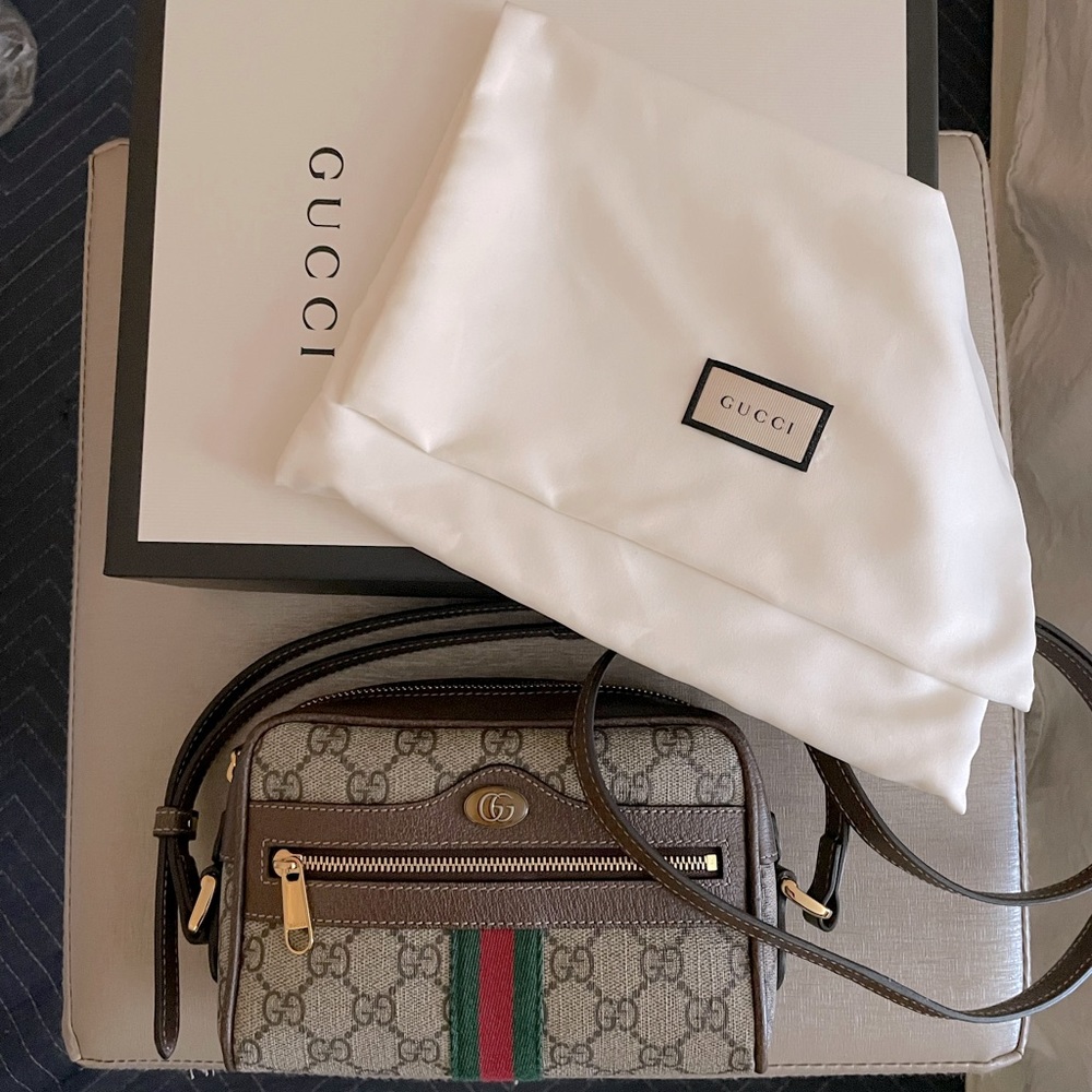 GUCCI Supreme Ophidia GG crossbody mini camera bag.